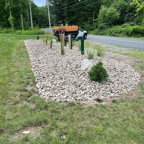 pipes area covered with rocks on a yard