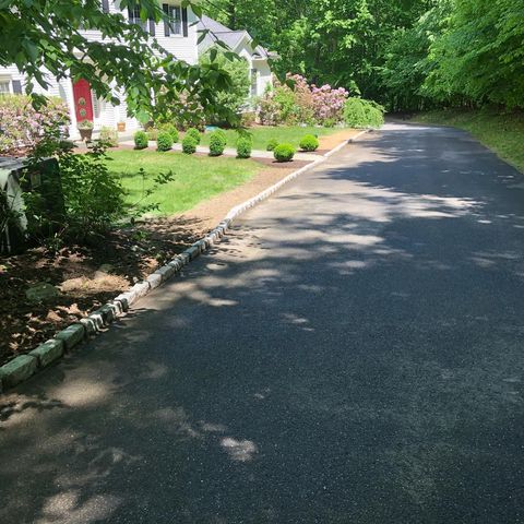 lawn maintenance black road mulch added