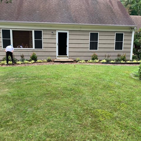 lawn and man working on planter