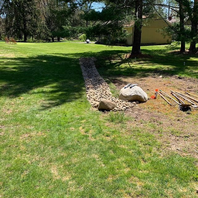 rock water drain in grass lawn